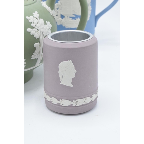 76 - A collection of Wedgwood Jasper ware to include a lilac vase/ table lighter, a sage green teapot (sp... 