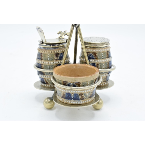 90 - Doulton Lambeth three-piece stoneware cruet set with a silver plated stand with marks to base, 'AS' ... 