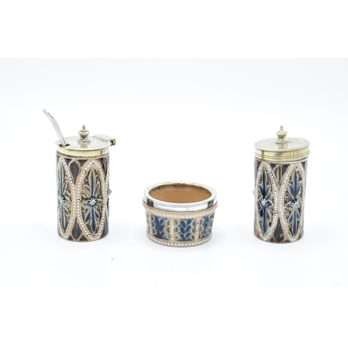 91 - Doutlon Lambeth 3 piece stoneware cruet set with a silver plated stand, circa 1876 with marks to bas... 