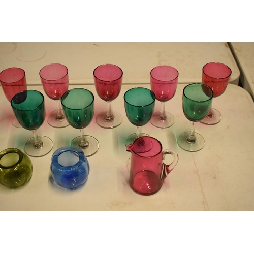 10A - A collection of various coloured 20th glass to include wine glasses of different sizes, bowls etc (s... 