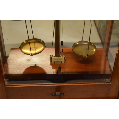 175 - A set of laboratory scales in a wooden case made by Philip Harris and Co Ltd. In good condition. Sol... 