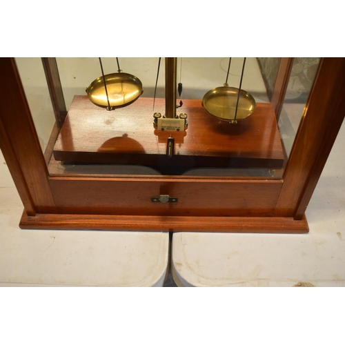 175 - A set of laboratory scales in a wooden case made by Philip Harris and Co Ltd. In good condition. Sol... 