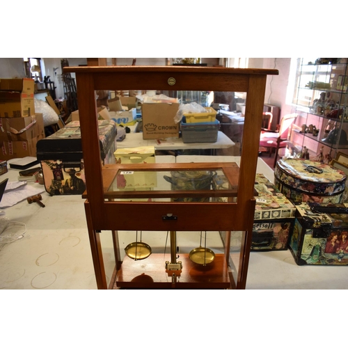 175 - A set of laboratory scales in a wooden case made by Philip Harris and Co Ltd. In good condition. Sol... 