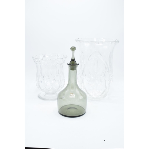 179 - A pair of lead crystsal glass vases together with a Orrefors smoky glass decanter (3). In good condi... 