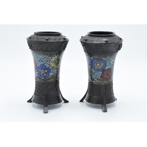 183 - A pair of art-nouveau metal vases each on tri-legs with cloisonné style decoration. Signs of wear an... 