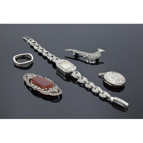 230F - A collection of silver and silver-coloured items to include brooches, a ring and a stainless steel m... 