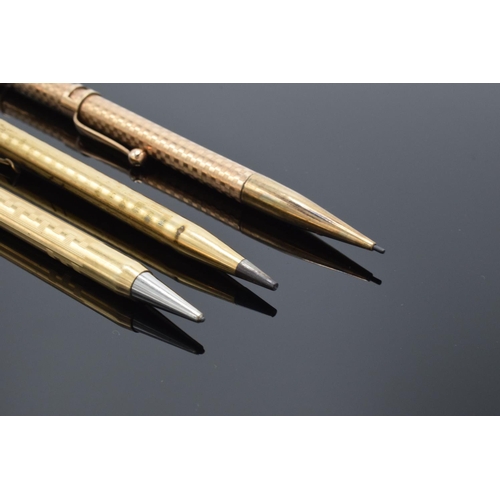 250G - A collection of gold plated propelling pencils to include makers such as Eversharp x 2 and Maxim. AL... 