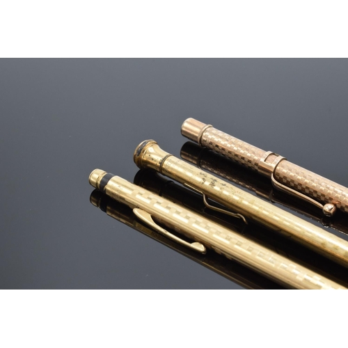 250G - A collection of gold plated propelling pencils to include makers such as Eversharp x 2 and Maxim. AL... 