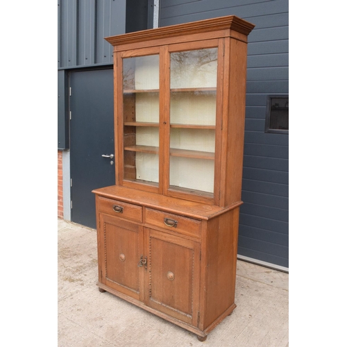 331 - Edwardian/ 20th century golden oak book case with glass doors. In good condition with age related we... 