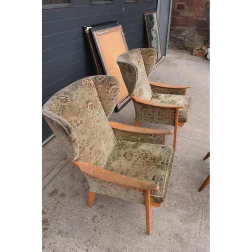 333 - A pair of Parker Knoll winged back chairs together with a reproduction captains chair. 95cm tall. As... 