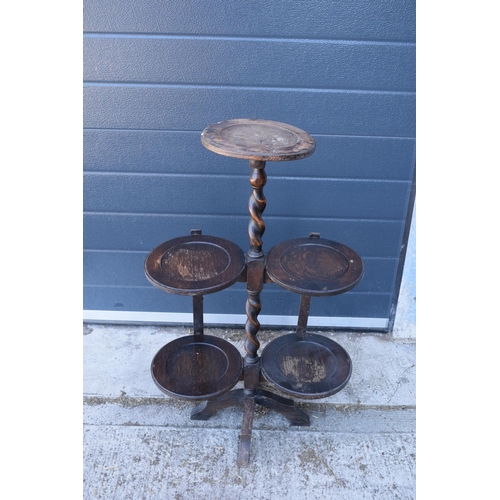 345 - A 1930s wooden lazy waiter/ folding 3 tiered stand. 77cm tall. Age related wear and tear