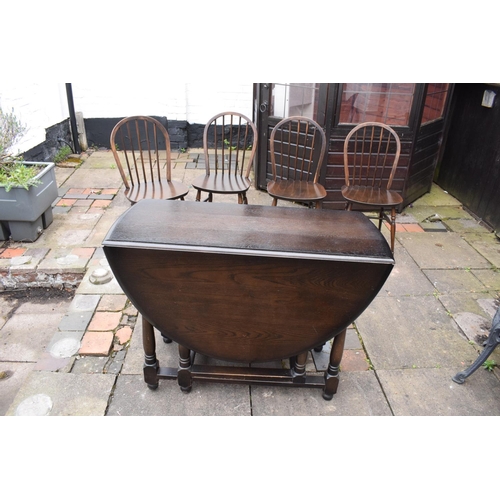 330D - Wooden 20th century priory style drop leaf dining table together with 4 spindle back chairs. In good... 