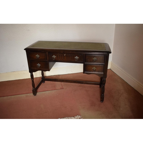 347 - Wooden 20th century priory style desk/ sideboard with a leather insert. In good condition with age r... 