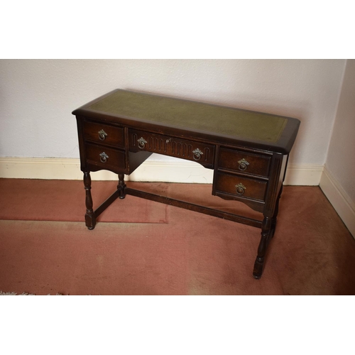 347 - Wooden 20th century priory style desk/ sideboard with a leather insert. In good condition with age r... 