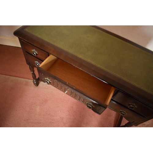 347 - Wooden 20th century priory style desk/ sideboard with a leather insert. In good condition with age r... 