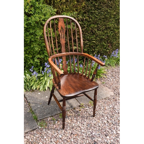 349 - A 19th century Windsor farmhouse armchair. In good condition with age related wear and tear to inclu... 