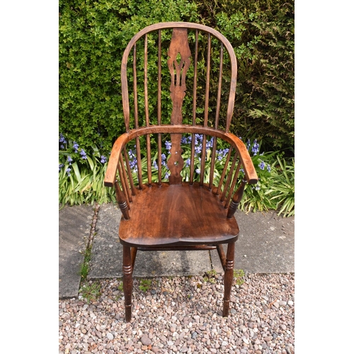 349 - A 19th century Windsor farmhouse armchair. In good condition with age related wear and tear to inclu... 