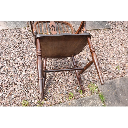 349 - A 19th century Windsor farmhouse armchair. In good condition with age related wear and tear to inclu... 