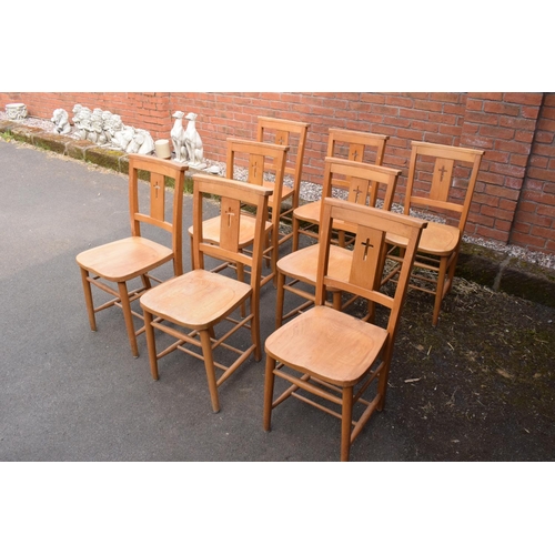 320 - 8 mid 20th century pine chapel chairs with a crucifix shape in the back. 86cm tall. Each in good fun... 