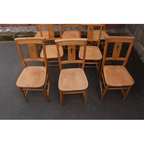 320 - 8 mid 20th century pine chapel chairs with a crucifix shape in the back. 86cm tall. Each in good fun... 