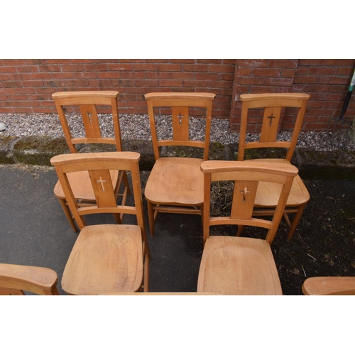 320 - 8 mid 20th century pine chapel chairs with a crucifix shape in the back. 86cm tall. Each in good fun... 