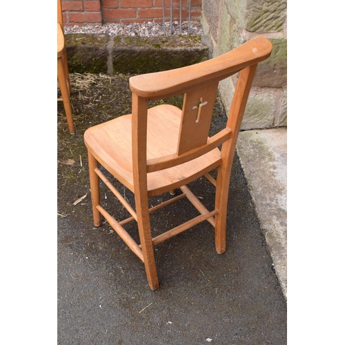 320 - 8 mid 20th century pine chapel chairs with a crucifix shape in the back. 86cm tall. Each in good fun... 