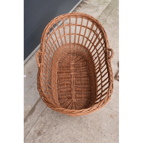 304 - A large wicket basket together with a carpet basher (2).