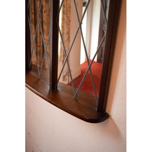 312 - A 20th century wooden mirror with Tudor style/ diamond shaped design. 95 x 74cm. In good condition.