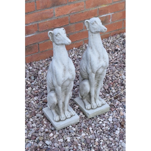 318 - Reconstituted stone models of greyhounds. 54cm tall. 

Made in England, these items are frost and we... 