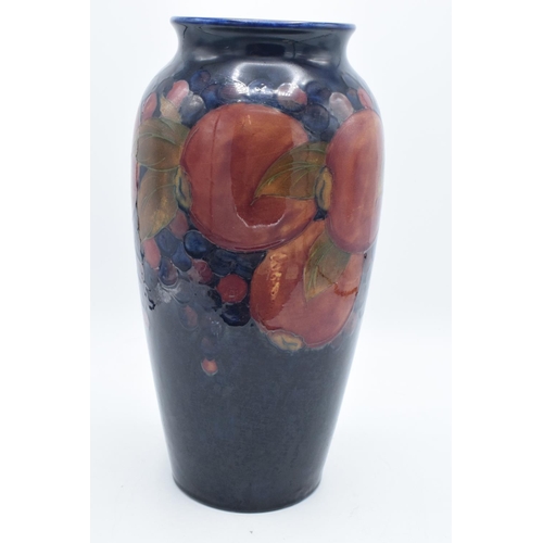 86A - Moorcroft tall tubular vase in the Pomegranate design. There has been some professional restoration ... 