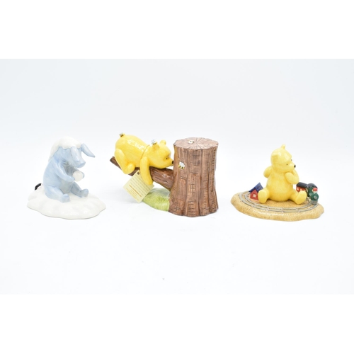 116 - A collection of Royal Doulton Winnie the Pooh figures to include It's Honey all the way down, Rum-tu... 