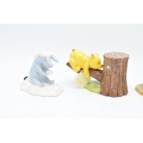 116 - A collection of Royal Doulton Winnie the Pooh figures to include It's Honey all the way down, Rum-tu... 