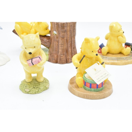 116 - A collection of Royal Doulton Winnie the Pooh figures to include It's Honey all the way down, Rum-tu... 