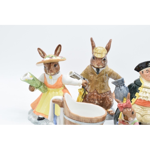 124 - A collection of Royal Doulton to include a Long John Silver character teapot, Bunnykins Lord and Lad... 