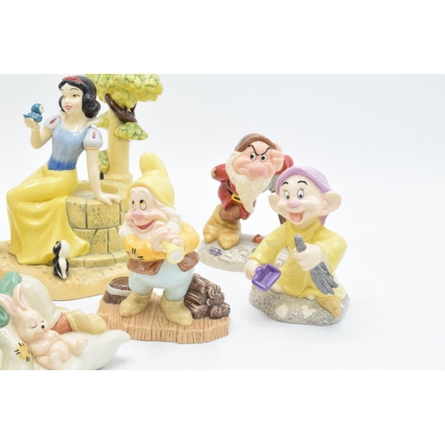 128 - A collection of Royal Doulton Snow White and the 7 Dwarfs figure to include Aw, Shucks SW23, Fairest... 