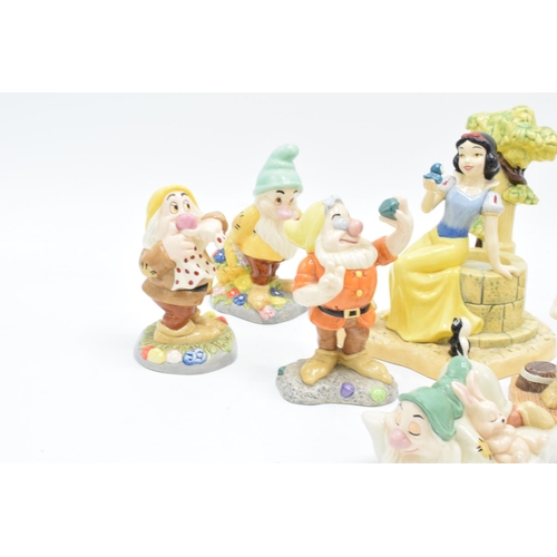 128 - A collection of Royal Doulton Snow White and the 7 Dwarfs figure to include Aw, Shucks SW23, Fairest... 