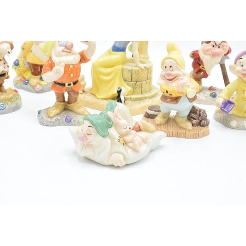 128 - A collection of Royal Doulton Snow White and the 7 Dwarfs figure to include Aw, Shucks SW23, Fairest... 