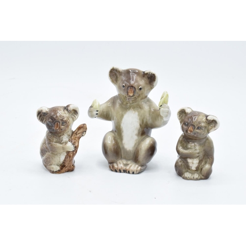 167 - Beswick Koala Bears to include koala eating fruit 1089, bear on branch 1039 and similar 1040 (3). In... 