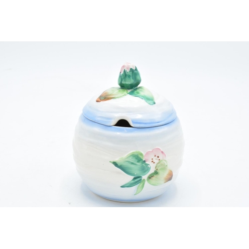 191 - Clarice Cliff (Newport Pottery) preserve pot in the Apple Blossom design with a bud finial. In good ... 