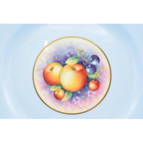 195 - A Royal Worcester 27cm diameter dinner plate with a fruit scene design surrounded by a light blue ba... 