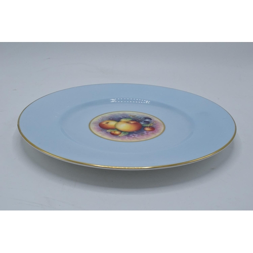 195 - A Royal Worcester 27cm diameter dinner plate with a fruit scene design surrounded by a light blue ba... 