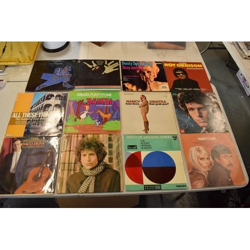 200 - A collection of LPs from a range of dates to include a variety of artists such as Nancy Sinatra, Roy... 