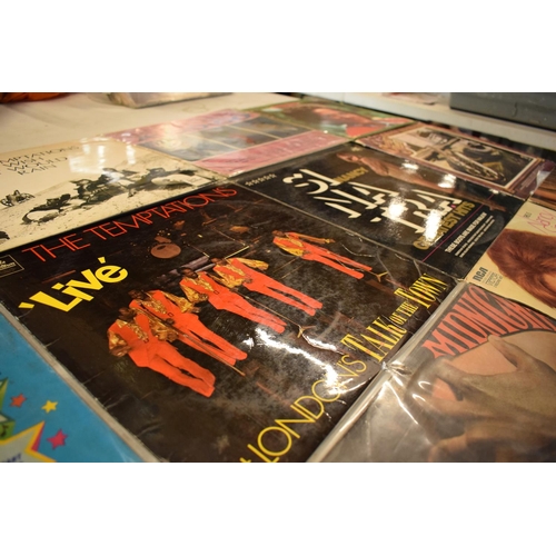 200 - A collection of LPs from a range of dates to include a variety of artists such as Nancy Sinatra, Roy... 