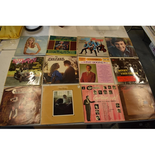 200 - A collection of LPs from a range of dates to include a variety of artists such as Nancy Sinatra, Roy... 