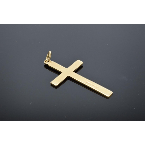 202 - A hallmarked 9ct gold crucifix pendant, 3cm in length. 1.2 grams.