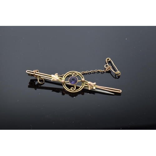 203 - A 9ct gold bar brooch set with an amethyst stone, 2.1 grams gross weight. Slight loss to the catch f... 