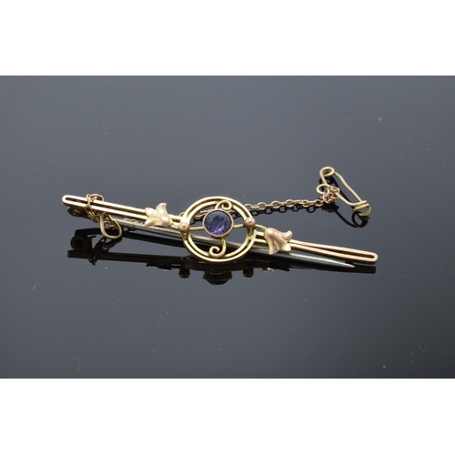 203 - A 9ct gold bar brooch set with an amethyst stone, 2.1 grams gross weight. Slight loss to the catch f... 