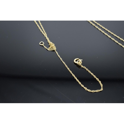 207 - A 9ct gold chain and heart pendant set with CZ, total weight 1.1 grams (tangled).