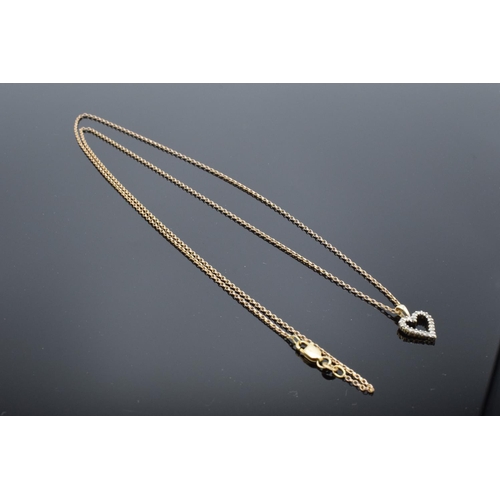 209 - A 9ct gold chain together with a 9ct gold heart-shaped pendant with semi-precious stones, gross weig... 