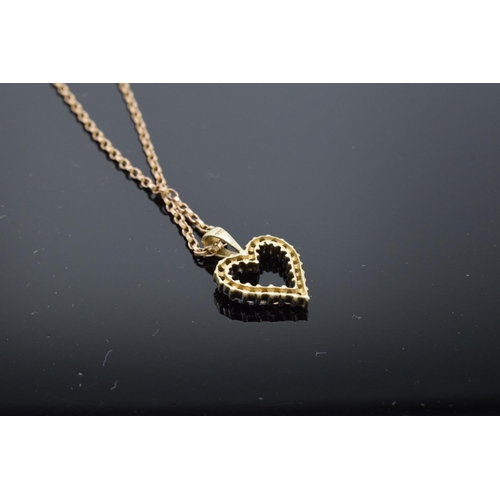 209 - A 9ct gold chain together with a 9ct gold heart-shaped pendant with semi-precious stones, gross weig... 